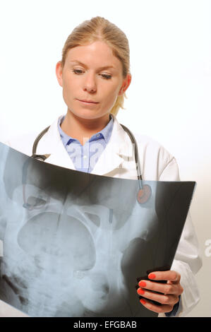 Female doctor examining an x-ray image Stock Photo