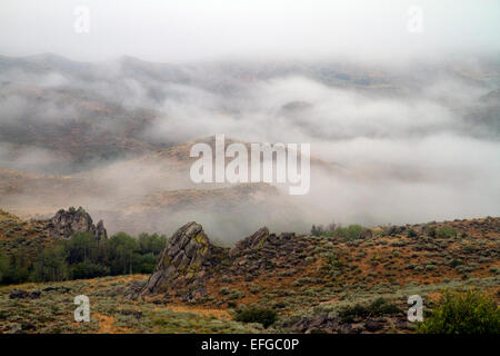 Fog blanketing the mountains along US 20 in Elmore County, Idaho, USA. Stock Photo