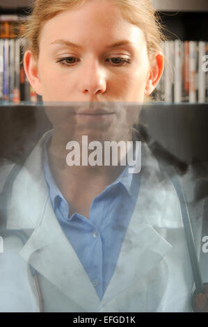 Female doctor examining an x-ray image Stock Photo