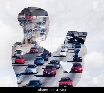 Woman with digital tablet composited with images of traffic Stock Photo