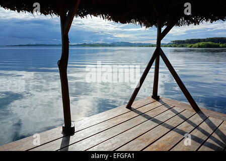 Peaceful view from a tropical hut over the sea with islands at the horizon, archipelago of Bocas del Toro, Caribbean, Panama Stock Photo