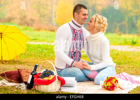 laughing beautiful couple spending time at the picnic Stock Photo