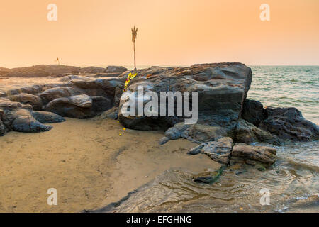 Shiva's face in the rock on the beach in Goa Stock Photo