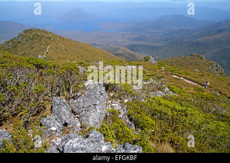 Hiker above Lake Pedder on the trail to Mt Anne, the highest peak in south west Tasmania Stock Photo