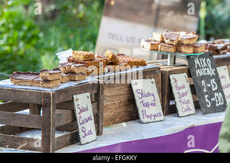 Food fair cake stall selling home made cakes and treats. Stock Photo
