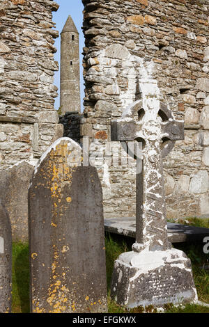 Tomb stones, St Kevin's Cathedral and Round Tower, Glendalough, County Wicklow, Ireland Stock Photo