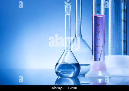 Laboratory equipment, bottles, flasks with pink,light red  liquid Stock Photo