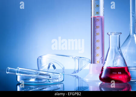 Laboratory equipment, bottles, flasks with pink,light red  liquid Stock Photo