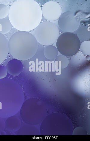 Gradient Purple Oil drops in the water -abstract background Stock Photo