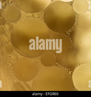 Gold,beige,brown Gradient Oil drops in the water -abstract background Stock Photo