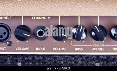 retro guitar amplifier control panel with knobs Stock Photo