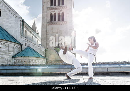 Pair of capoeira performers doing a kicking Stock Photo