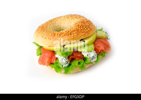 Bagel with lettuce, cream cheese, salmon and green apple. Isolated Stock Photo