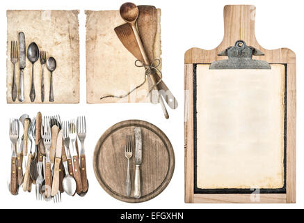 kitchen board, aged recipe paper and vintage cutlery isolated on white background. set of kitchen utensils Stock Photo