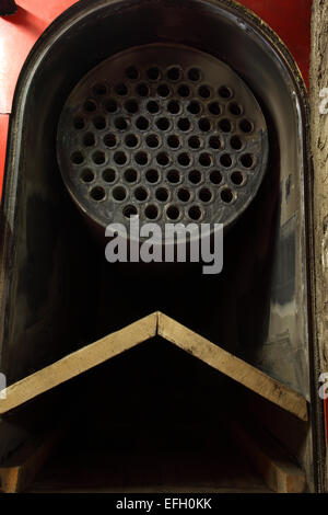 Detail of perforated industrial machine component in biomass plant, close up Stock Photo