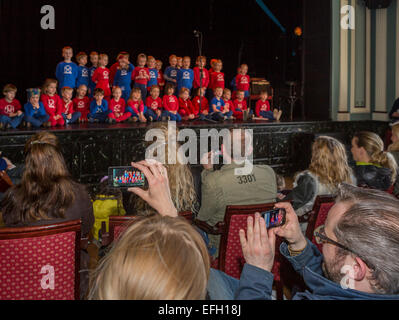 People taking pictures of children performing at the Idno Theater, Annual Children's Festival, Reykjavik, Iceland Stock Photo