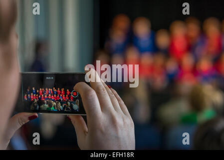 People taking pictures of children performing at the Idno Theater, Annual Children's Festival, Reykjavik, Iceland Stock Photo
