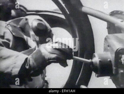 A guidance operator on board a Heinkel He 177 Greif controls a Henschel Hs 293 anti-shipping air to surface guided missile after being dropped from the aircraft during testing in December 1940. The missile powered by a  Walter HWK 109-507 rocket motor was remote controlled via radio enabling the operator to change the missile's course using a joystick. Stock Photo