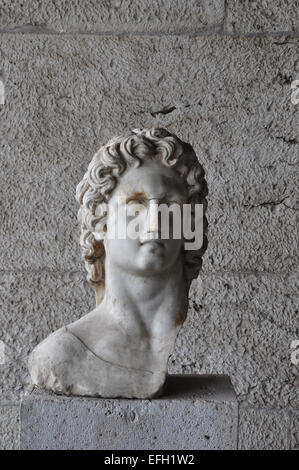 Bust of greek mythology sun god Helios. Broken marble statue of male figure at the ancient agora of Athens, Greece. Stock Photo