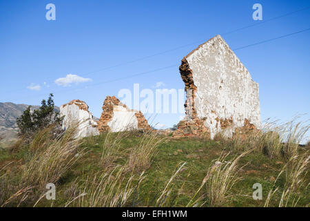 Ruin on hill of old farmhouse inland, Mountains of Mijas in background, Costa del Sol, Andalusia, Spain. Stock Photo