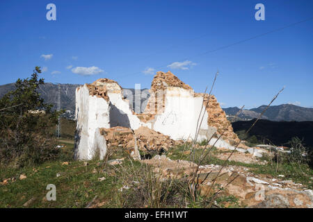 Ruin on hill of old farmhouse inland, Mountains of Mijas in background, Costa del Sol, Andalusia, Spain. Stock Photo