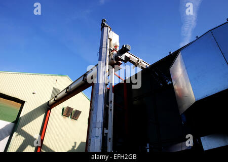 Industrial piping outside biomass fuel plant Stock Photo