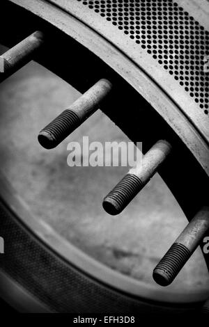 Detail of perforated industrial machine component in biomass plant, black & white close up Stock Photo