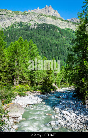 Hiking to Argentiere glacier with the view on the massif des Aiguilles Rouges in French Alps Stock Photo