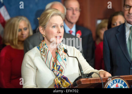 US Senator Senator Kirsten Gillibrand along with Senators Chuck Schumer and families of aviation victims launch a push to protect federal aviation safety regulations during a press briefing February 4, 2015 in Washington, DC. The Republican majority in Congress has indicated they intend to roll back regulations enacted after 9/11 with the reauthorization of the Federal Aviation Administration. Stock Photo