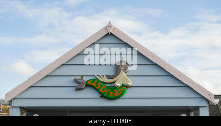 mermaid sign on gable end of b each hut Stock Photo