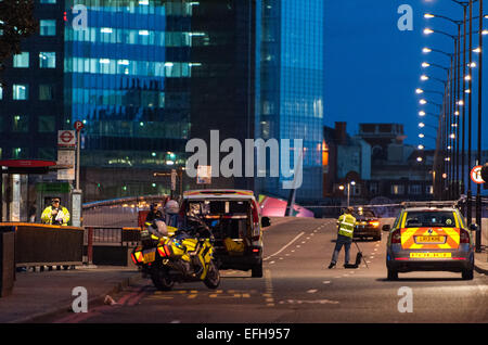 Metropolitan Police officers on the London Bridge investigate the aftermath of a collision in which a cyclist was killed  Featuring: View,Metropolitan police officers Where: London, United Kingdom When: 02 Aug 2014