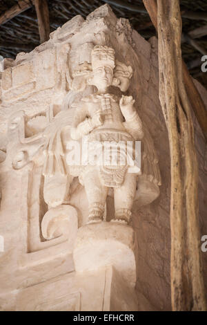 Winged Mayan Warrior. Corner decoration at the Altar of the Jaguar on the main pyramid tomb. Stock Photo