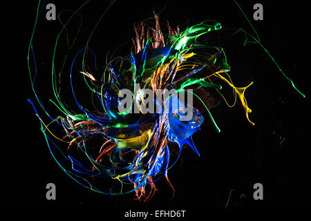taboo messy brat doll toy with hair flung out coated in colored liquid making a mess Stock Photo