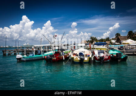 A group of fishermen boat at the pier in cCncun, Isla Mujeres, Mexico Stock Photo