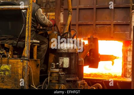 Work Hard Factory Hard work in a Foundry, Melting Iron Stock Photo - Alamy