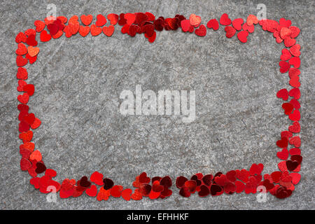 simple frame made from many red heart confetti pieces Stock Photo