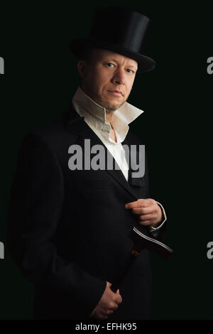 Middle aged man in a classic suit with Top Hat and walking stick Stock Photo