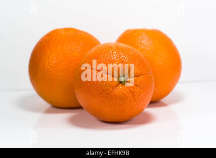 Three oranges isolated on a white background. Stock Photo
