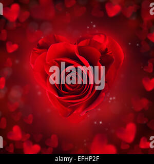 Red rose blossom in heart shape with abstract blur background Stock Photo