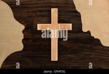 christian couple pray concept cross wooden silhouette paper cut Stock Photo