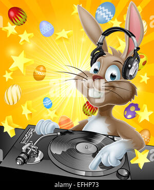 A cartoon Easter Bunny DJ with headphones on at the record decks with chocolate Easter eggs in the background Stock Photo