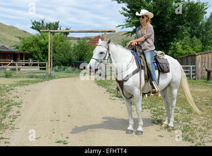 Girl on horseback, La Reata Ranch, Saskatchewan, Canada. Stock Photo