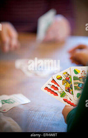 Persons playing cards, Styria, Austria Stock Photo