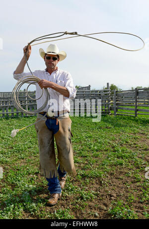 Cowboy with lasso, George Gaber, owner of La Reata Ranch, Saskatchewan, Canada Stock Photo