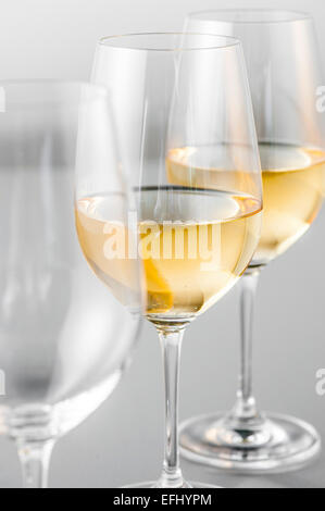 Two glasses of white wine and an empty glass, Hamburg, Northern Germany, Germany Stock Photo