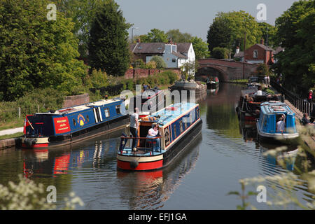 Narrowboats on the Bridgewater Canal looking towards Lymm Bridge at Lymm in Cheshire Stock Photo