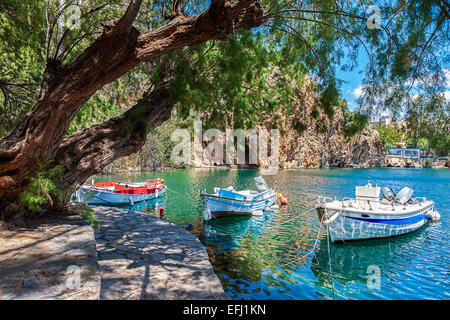 Boats on Lake Voulismeni. Agios Nikolaos, Crete, Greece Stock Photo