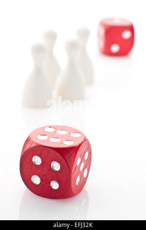 Two dice and gaming pieces Stock Photo