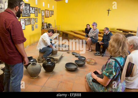 San Bartolo Coyotepec, Mexico - Javier Nieto Castillo demonstrates the making of black pottery at the Doña Rosa studio. Stock Photo