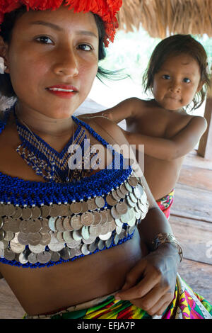 Portrait of native woman and child embera in the village of the Native Indian Embera Tribe, Embera Village, Panama. Panama Ember Stock Photo